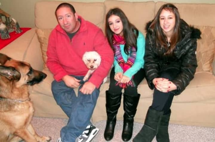 Glen Hochman with daughters Deanna, center, and Alissa, and two of the family&#x27;s three dogs also killed in Saturday&#x27;s tragedy.