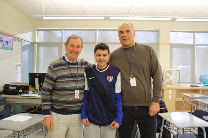 Eighth-grader Joseph Grogan with teachers Rick Burmester and Joseph Cirasella. 