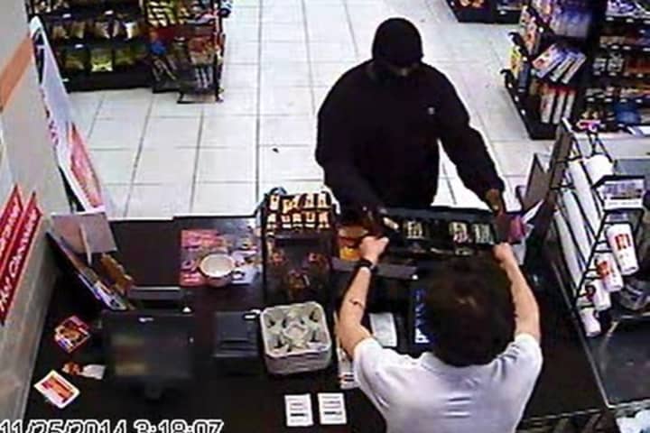 Surveillance footage of the armed robbery of a Sunoco Gas Station in Norwalk in November.