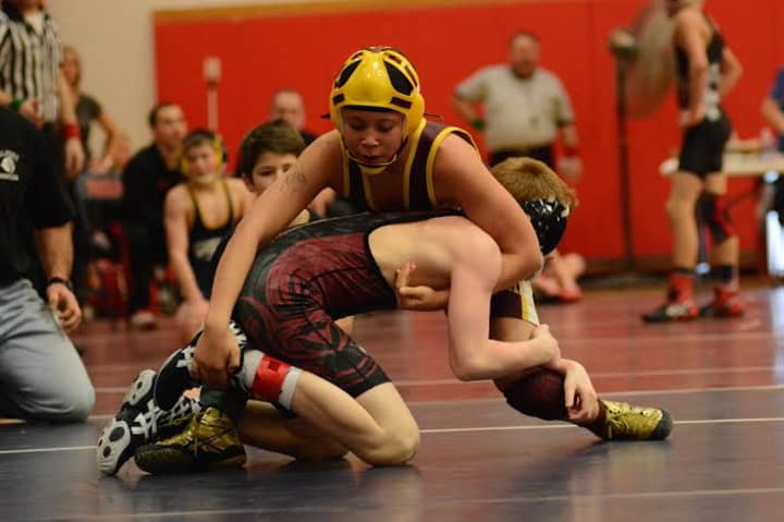 Koy Price of the Norwalk Mad Bulls controls his opponent en route to his fourth straight regional wrestling championship.