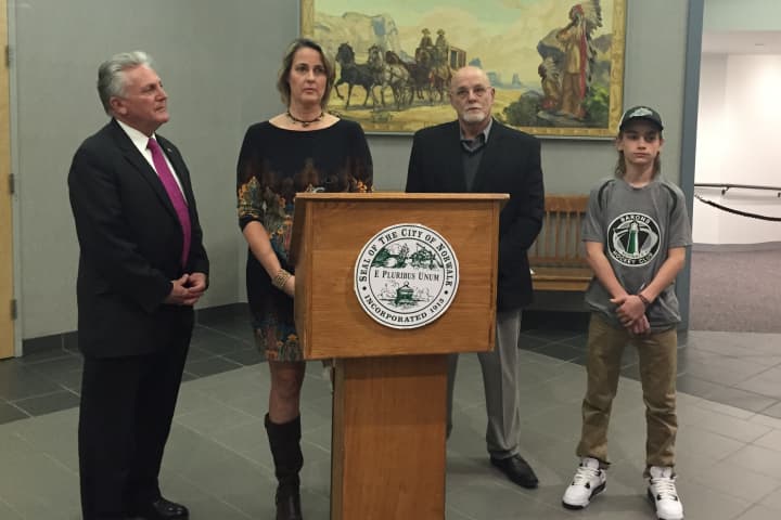 Mayor Harry Rilling, Katheine Snedaker, Jerry Petrini and Wyatt Machette at a press conference announcing new concussion guidelines for Norwalk youth sports.