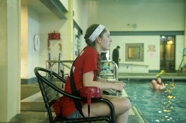 Beatrix Dalton keeps watch as a lifeguard at the Ridgefield Recreation Center&#x27;s pool.