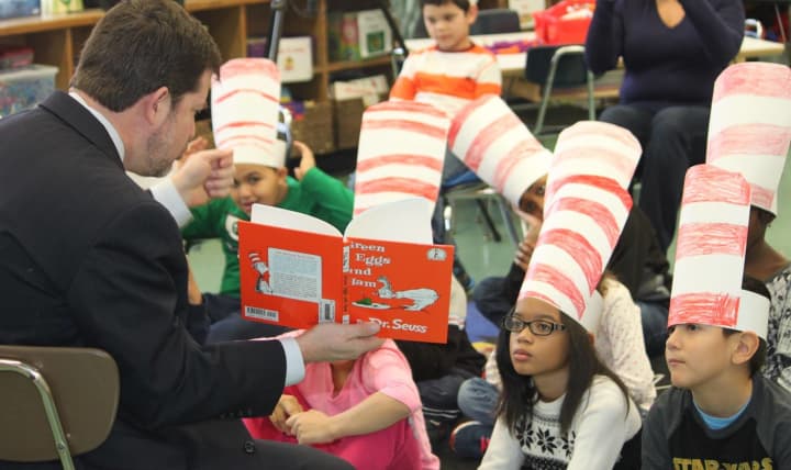New Rochelle Superintendent of Schools Brian Osborne reads &quot;Green Eggs and Ham&quot; to an attentive Trinity Elementary School class. 