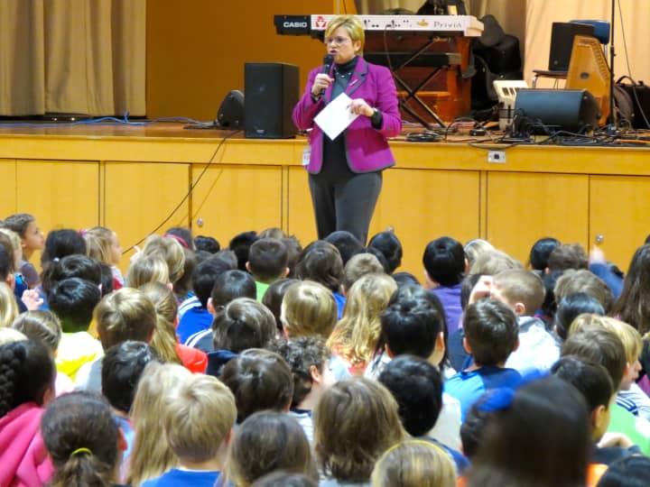 Todd Elementary School Principal Nadine McDermott introduced folk musician Tom Chapin and his band at a special schoolwide assembly on Wednesday, Feb. 4. 