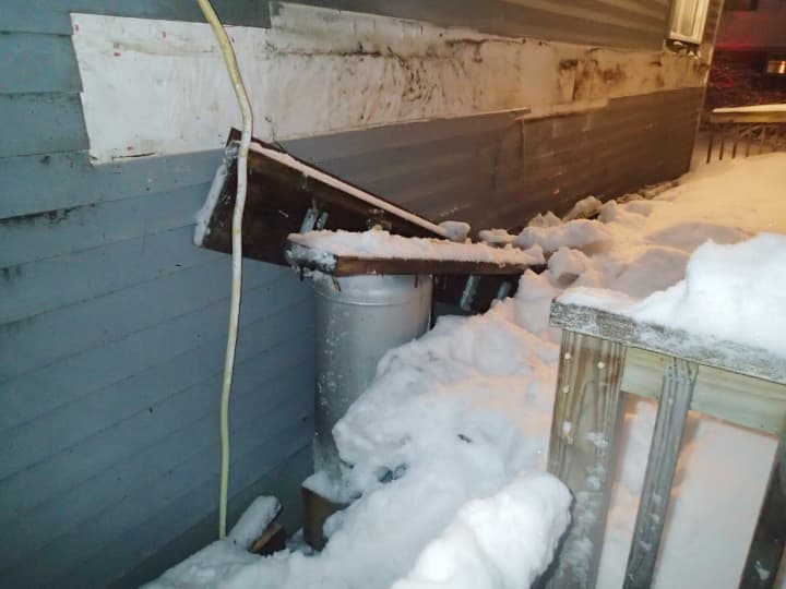 They weight of the heavy snow accumulation caused a deck to collapse on a Westport home, damaging the propane tank and causing a leak. 