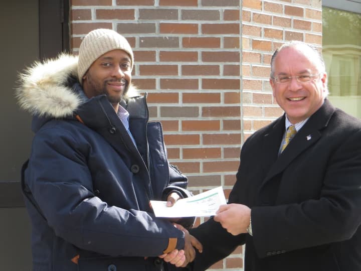 From left, ECAP Director Don Brown and Eastchester Supervisor Anthony S. Colavita with the town&#x27;s annual grant check to the organuzation.