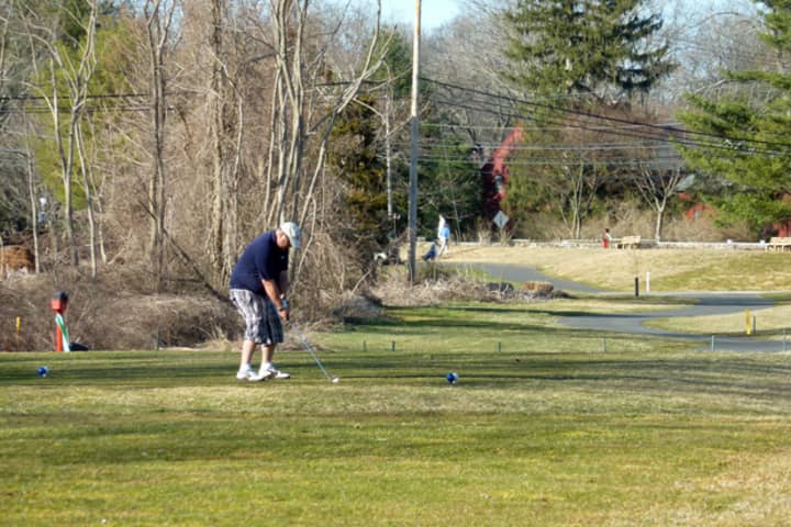 A golfer gets ready to take his swing at Westport&#x27;s Longshore Golf Course.