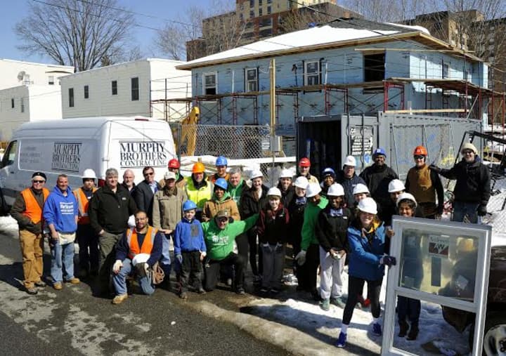 Murphy Brothers Contracting of Mamaroneck joined forced with other businesses and Iona College students to install 20 windows at a &quot;Home for Heroes&quot; project in Yonkers.
