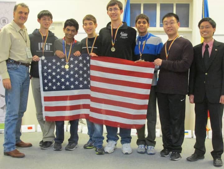 Greenwich High School junior Michael Kural, center, received one of 10 Gold Medals in the 2015 Romanian Master of Mathematics (RMM) competition. The international competition was held in Bucharest, Romania from Feb. 25 to March 1.