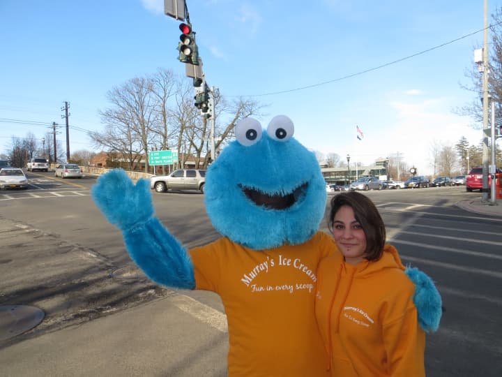 Cookie Monster, left, and Dana of Murray&#x27;s Ice Cream welcomed springlike temperatures on Wednesday at the corner of Halstead and Harrison avenues in Harrison.