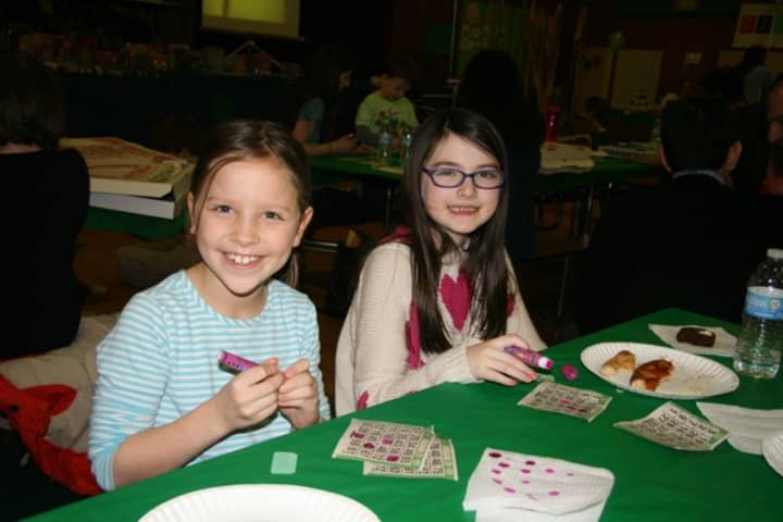 Pound Ridge Elementary School third-graders Ellie OBrien and Alexandra Weinstein enjoy the school&#x27;s annual bingo night. 
