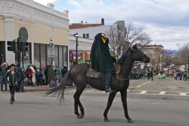 The Headless Horseman makes his way down Main St. in Sunday&#x27;s parade.