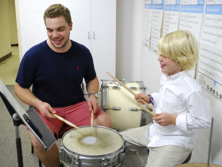 Darien Arts Center music instructor Willie Bruno gives a drum lesson to Duke Hagan, one of many music students enrolled at the DAC. Registration is open for summer music offerings as well as camps and programs in dance, visual arts and martial arts.