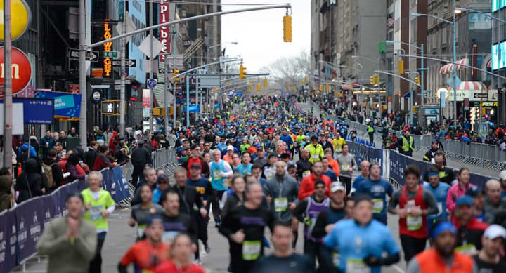 Runners make their way along the course during Sunday&#x27;s New York City Half Marathon.