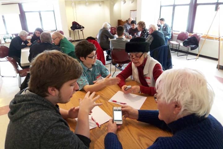 Somers teens volunteer to help seniors learn more about their electronic devices. 