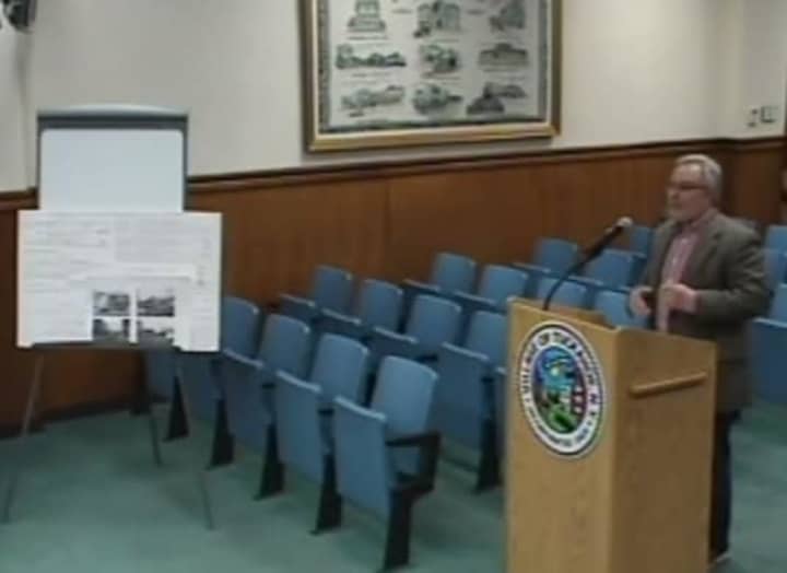 Scarsdale architect Leonard Brandes showing the plans for a possible Subway franchise in Tuckahoe. 