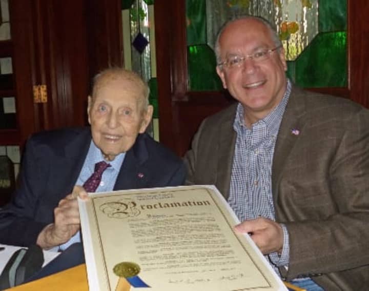 In celebration of his 100th birthday, Eastchester resident, Alfred J. Fenzel receives from Eastchester Town Supervisor Anthony S. Colavita, a congratulatory proclamation declaring March 12, 2015 to be Alfred J. Fenzel Day in Westchester County.