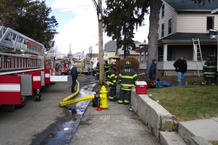 A home on Ely Avenue caught fire with an elderly bedridden woman inside Wednesday morning.