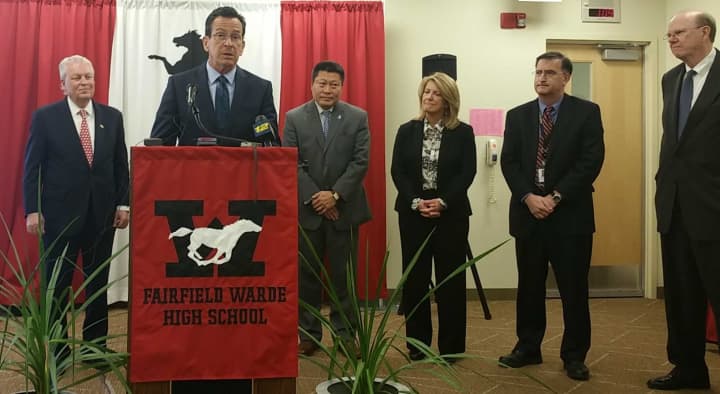 Gov. Dannel Malloy touts improved graduation rates in a stop at Fairfield Warde High School on Wednesday. 