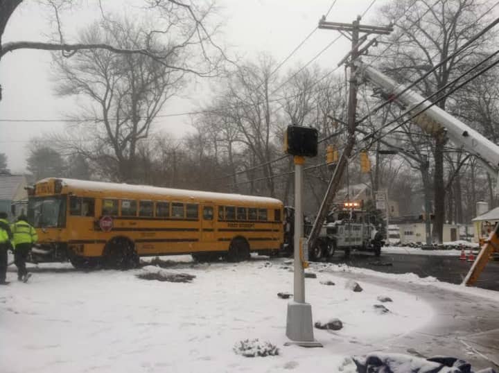 The school bus is towed from the crash scene Friday afternoon in Stamford. 