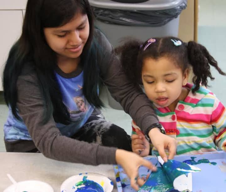 White Plains High School students visited Head Start Preschool to mentor students in art programs. 