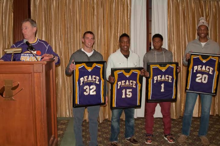Brian Kriftcher presents Stamford Peaces Kyle A. Markes 
Humanitarian Award to, from left: Ryan Kriftcher, Tyrell St. John, Jeremiah Livingston, and Kweshon Askew.