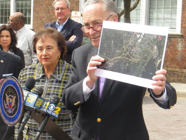 U.S. Sen. Charles Schumer shows the impact of a new Connecticut toll plaza on Interstate-95 near Port Chester and Rye. U.S. Rep. Nita Lowey, left, also was at Tuesday&#x27;s news conference.
