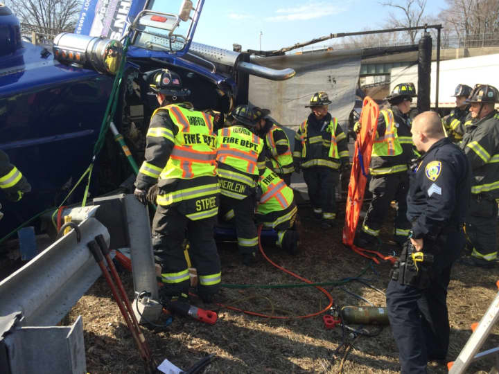 Fairfield firefighters work to free the truck driver. 
