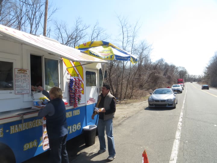 Customers, cars and trucks lined up Thursday outside Anthony&#x27;s New York Hotdogs &amp; More, one of two food trucks in the Town of Harrison. This truck is on Webb Avenue across from 2975 Westchester Ave., near Rye Brook.