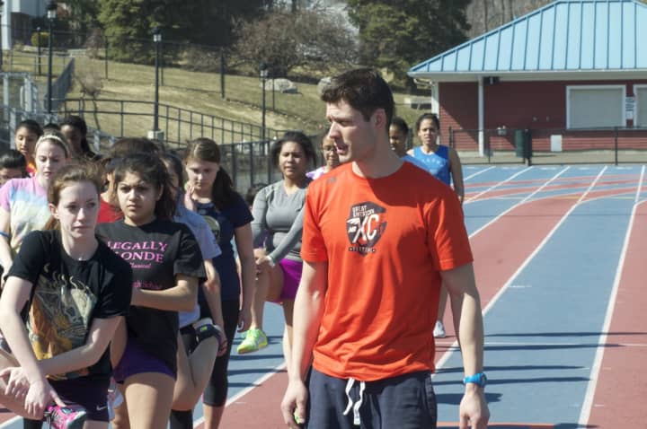 Danbury Hatters coach Nick Fraticelli talks to his team. Fraticelli, coach of the Danbury High School girls’ indoor track team, was named the Connecticut Coaches Association Indoor Track Assistant Coach of the Year.