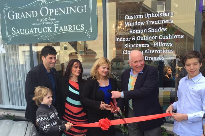 Saugatuck Fabrics owners Leonora Silber Ida Boci, along with family members and First Selectman Jim Marpe, cut the ribbon at the grand opening celebration of the new Westport store.