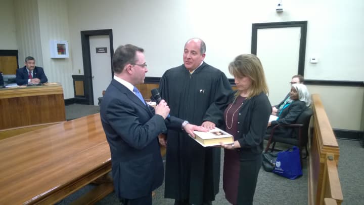 Dennis Pilla, left, was sworn in as mayor of Port Chester on Tuesday evening at Village Hall by Judge  Judge Anthony Provenzano. Pilla was joined by his wife, Margoth, at the ceremony.  
