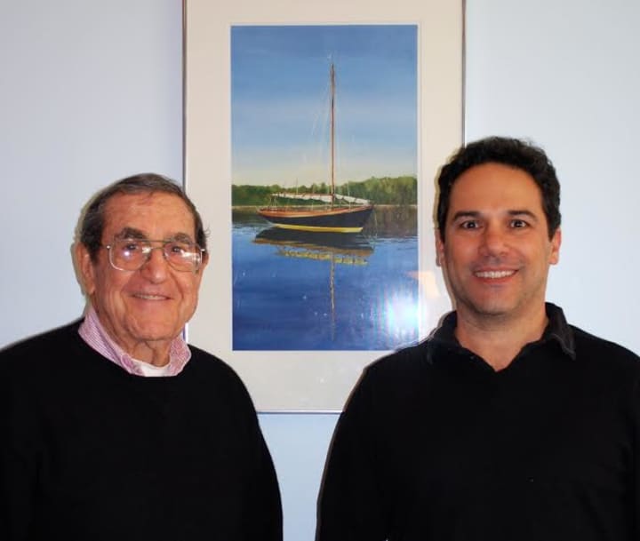 Award winning artist Stan Pastore, left, stands next to his artwork with Charly Sahlia, owner of UCBC Bakery and Café.
