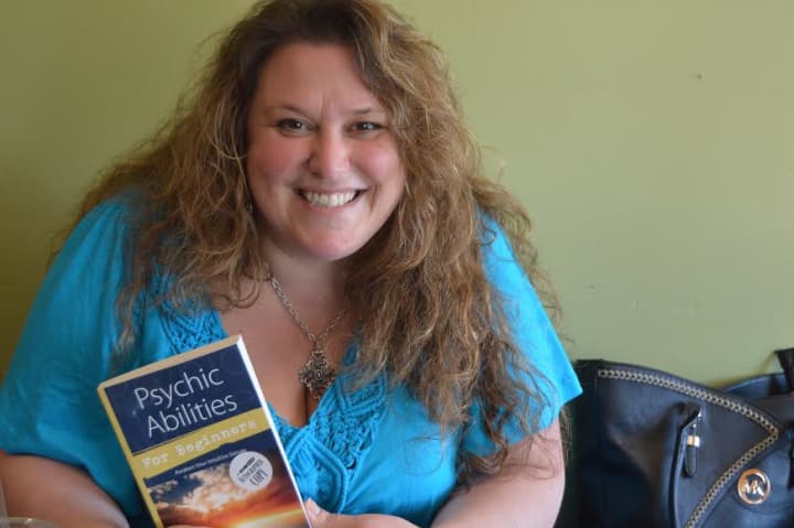 Melanie Barnum with her latest book, &#x27;Psychic Abilities for Beginners.&#x27;