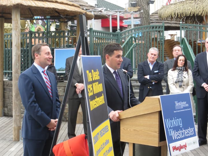 Standard Amusements co-founder Nicholas J. Singer, center, with Westchester County Executive Rob Astorino at Playland. Singer, a native of Harrison and co-founder of Standard Amusements, criticized Thursday&#x27;s legal action by the City of Rye.