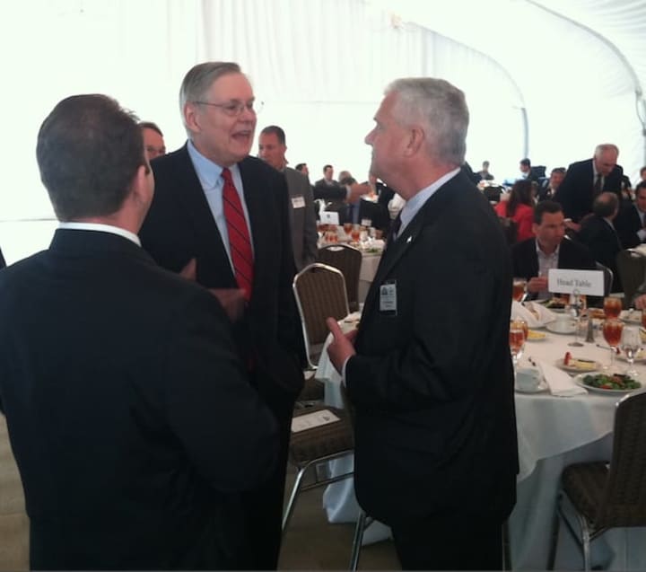 Stamford Mayor David Martin, center, talks with attendees just before his State of the City speech at the Hilton Stamford Hotel on Thursday. 