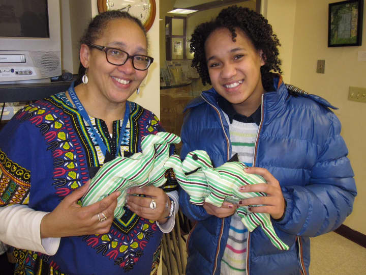 Gina Levon Simpson, with Leah Attai, right, a graduate of the Children&#x27;s Leadership Training Institute in Bridgeport, who made stuffed toys to donate to children. 