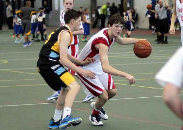 Staples High sophomore, Justin Seideman advances the ball for Academic Basketball Club&#x27;s U-16 team.
