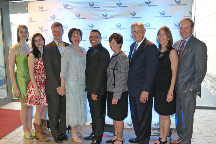 From left,  Hannah, Sarah, Michael, and Nancy Herde of Boston (formerly of New Canaan); Dr. Brian Davis, president of The Maritime Aquarium; Louise and Michael Widland of Norwalk; and Kit and Rob Rohn of Darien.