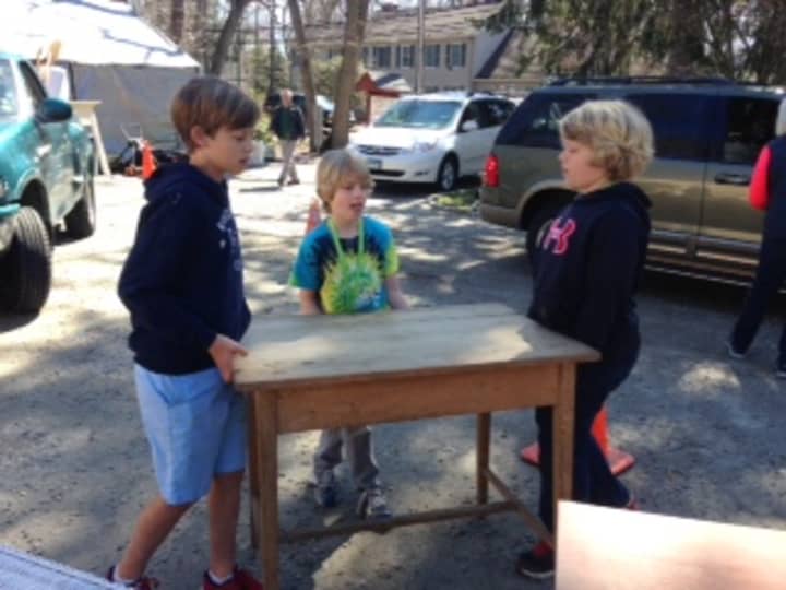 The Darien Boy Scouts prepare for the 43rd annual Giant Tag Sale at the Scout Cabin on Sunday.