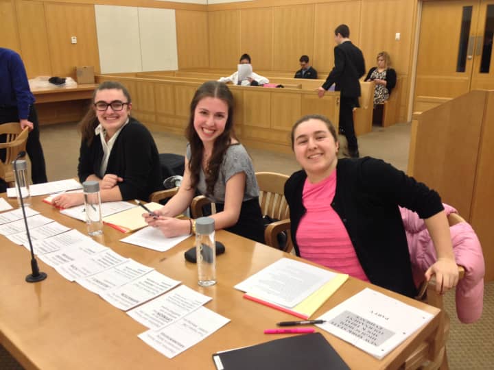 From left, John Jay High School mock trial team members Tara Carroll, Katie Ricca, and Hannah Shaw argued as the plaintiff team versus Clarkstown South during a recent competition at the Westchester County Courthouse.