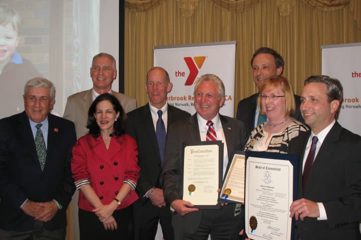 Members of the Norwalk YMCA and Wilton Family YMCA, as well as local elected officials, celebrate the merger of the two organizations into the Riverbrook Regional YMCA.