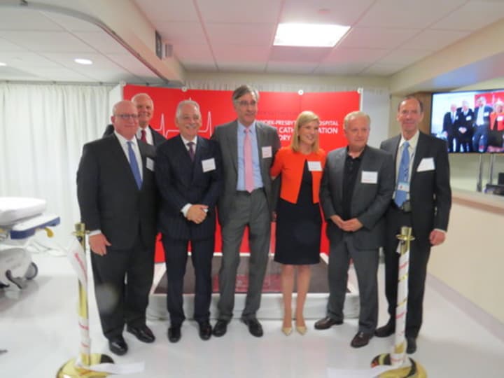 The team responsible for the new lab celebrating the grand opening in Bronxville with a ribbon cutting ceremony.