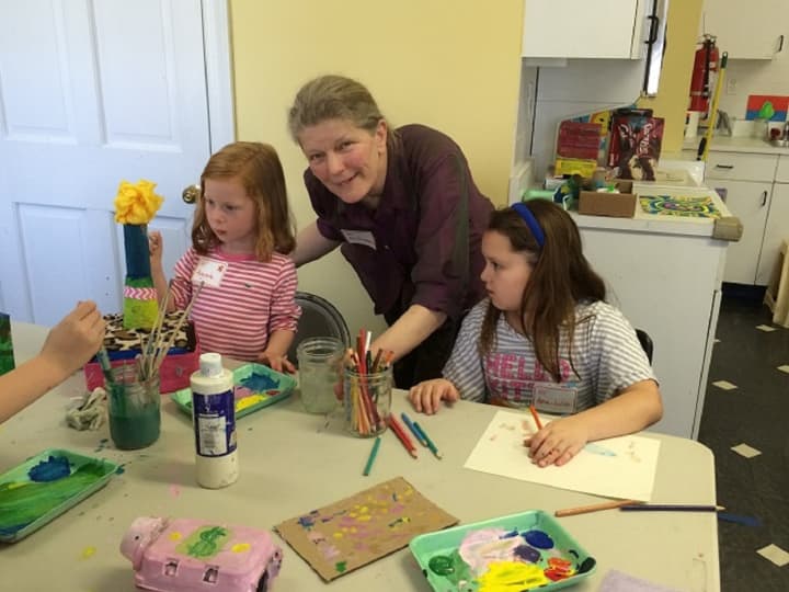 Augusta Wartels, YW art teacher Rowanda Shepard and Ana Julia Carnavale at a recent arts and crafts workshop at the YW.