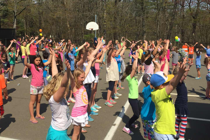 Tokeneke kids sing and dance along to &quot;YMCA&quot; at the Groove-a-thon event Monday.
