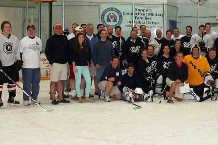 Some of the 200 players in a marathon hockey game in Ridgefield this weekend get ready to skate. The game will benefit Play For Purpose.