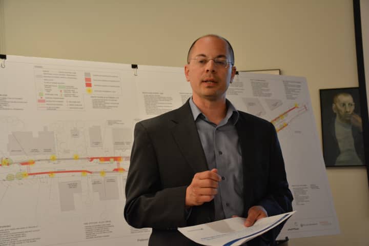 Anthony Ciriello of Milone &amp; MacBroom, the consulting firm working on the Scotts Corners overhaul. A map of the proposal is in the background.