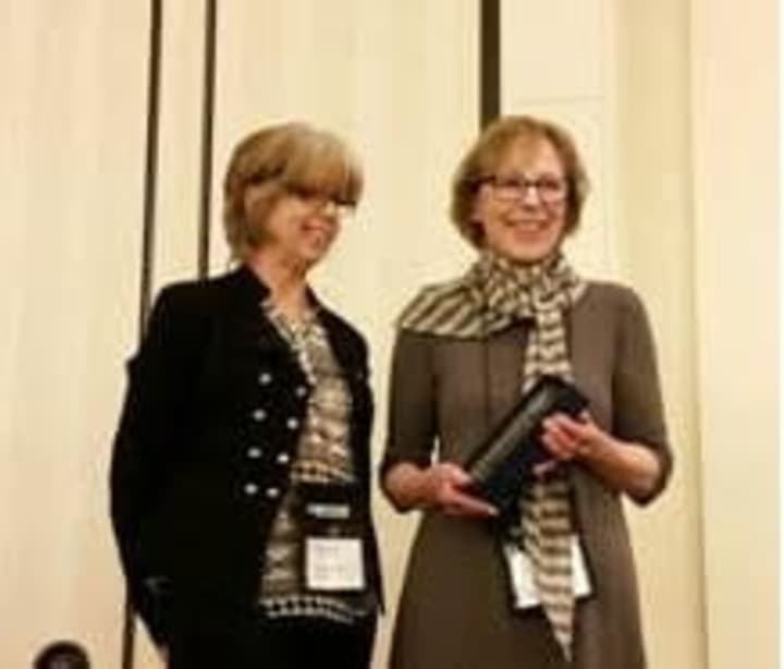 Alice Sherwood, right, receives the Connecticut Library Association Career Achievement Award from Mary Beth Rassulo, member of the association&#x27;s Selection Committee.