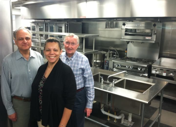 From left, John Gutman, Betsy Lopez and Mike Boyd from the New Covenant House of Hospitality stand in the kitchen at its new site at 174 Richmond Hill Ave. It opens in June.