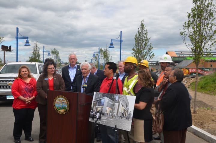 Former Bridgeport Mayor Leonard Paoletta joins Mayor Bill Finch, tradesmen and other officials in making the movie theater announcement in front of the Bass Pro Shop construction site.  